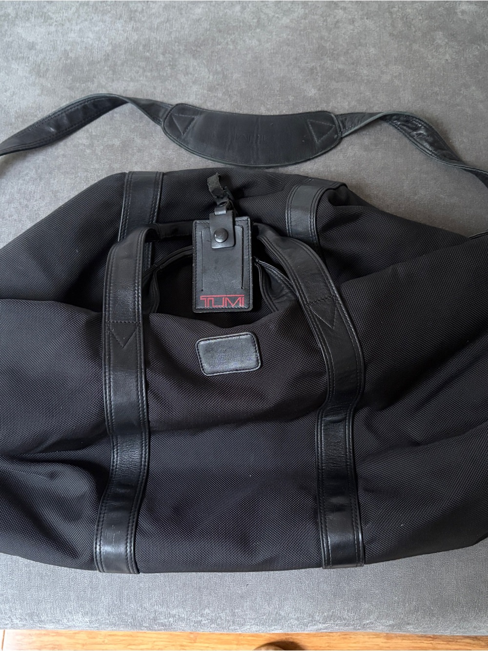Tumi Black Travel Duffel with Red Logo Accent